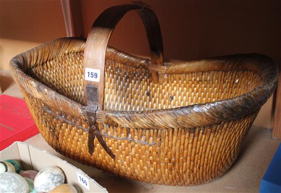 Pair of Flemish oak lion masks, two clay pipes (framed) and a vintage French trug